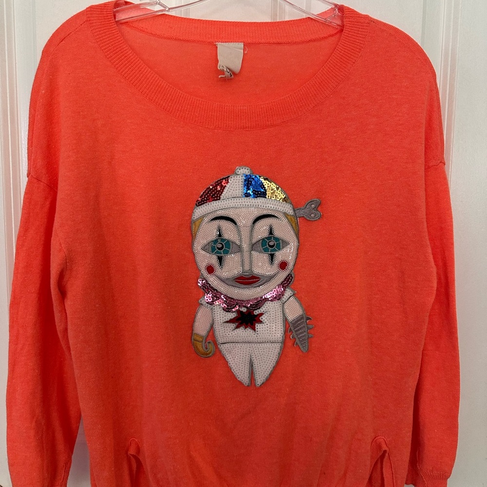 Vibrant Orange Sweater with Unique Patch Design